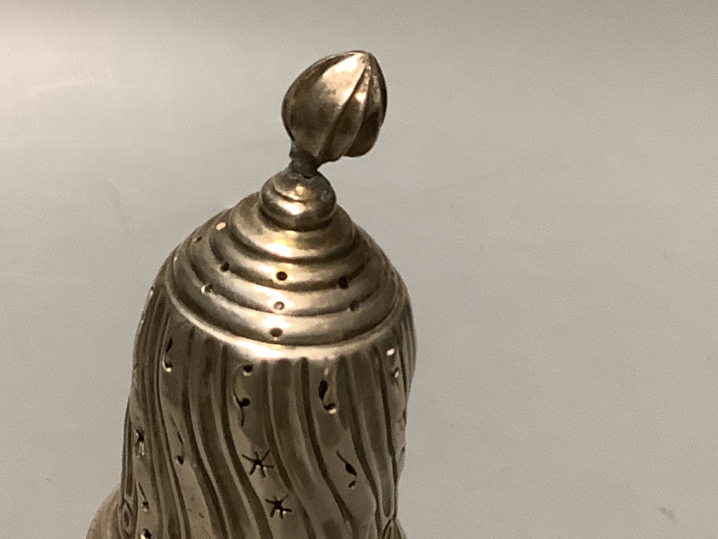 And Edwardian embossed silver sugar castor by Thomas Hayes, Birmingham, 1902, height 20.3 cm, 4 oz.